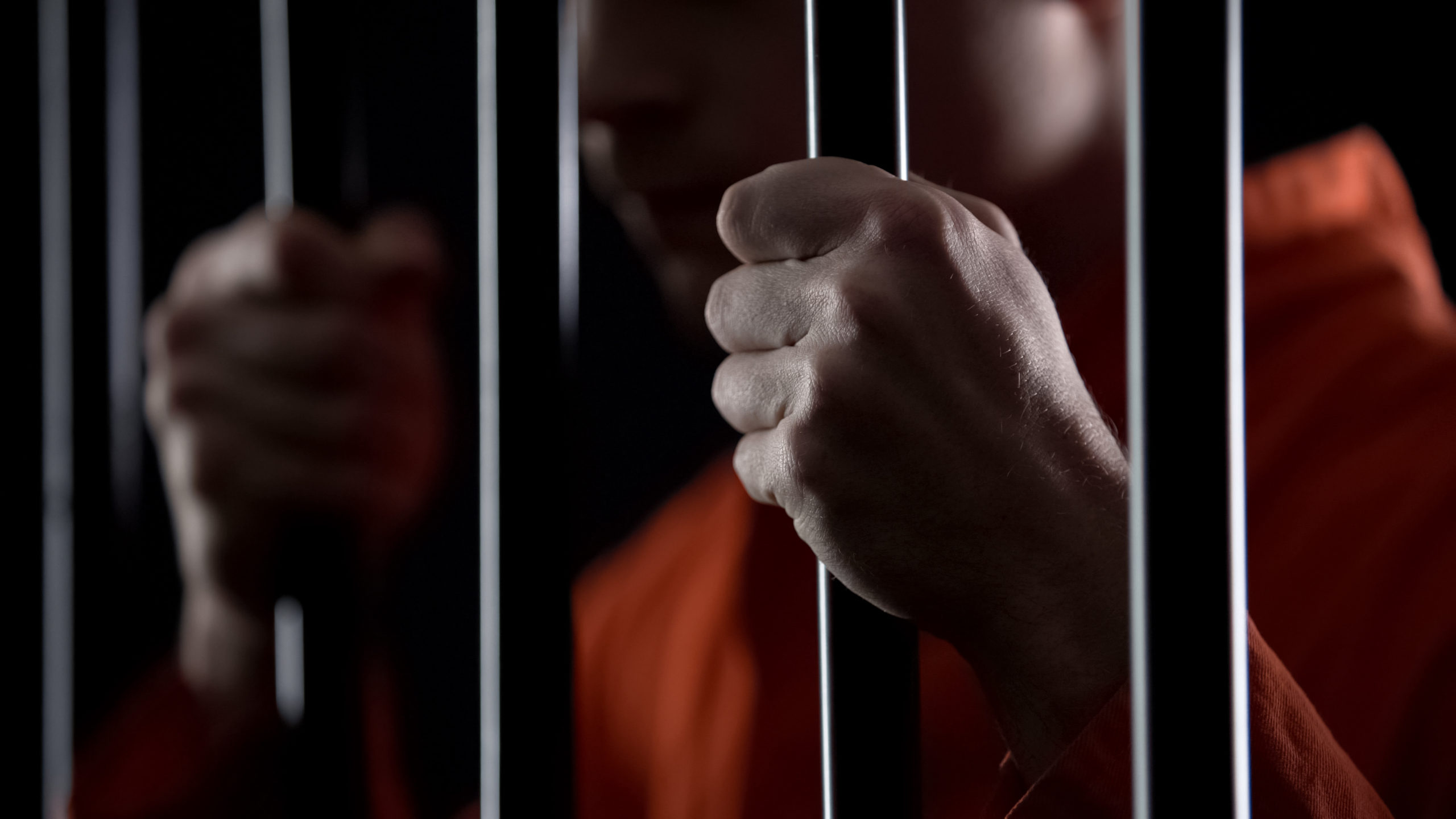 Criminal investigations - prisoner holding onto jail cell bars